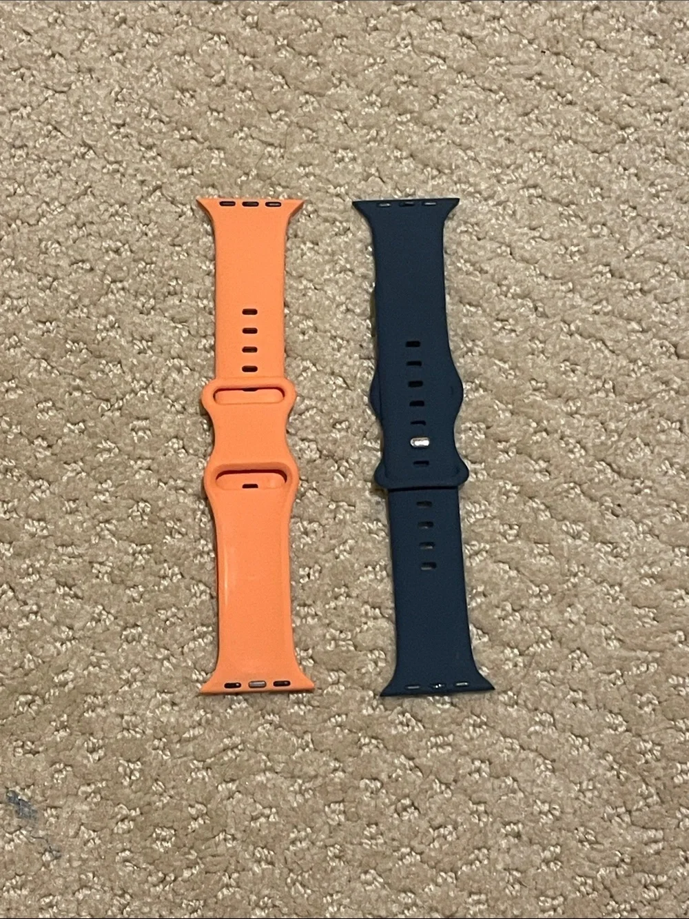Apple Watch wristbands (navy blue and pale orange)